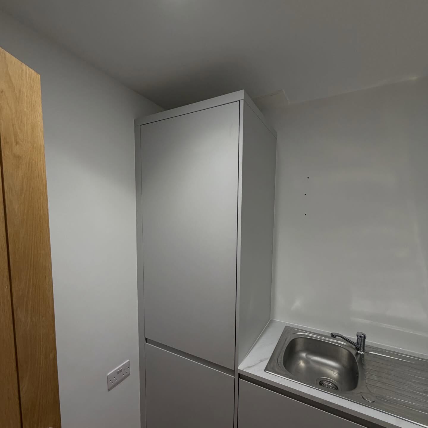 Fitted utility units and sink area after redecoration