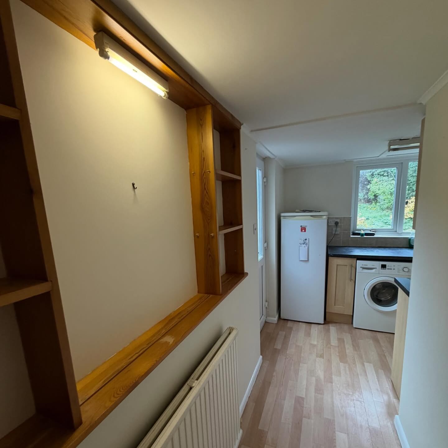 Timber alcove shelving in a loft space prepared ahead of painting