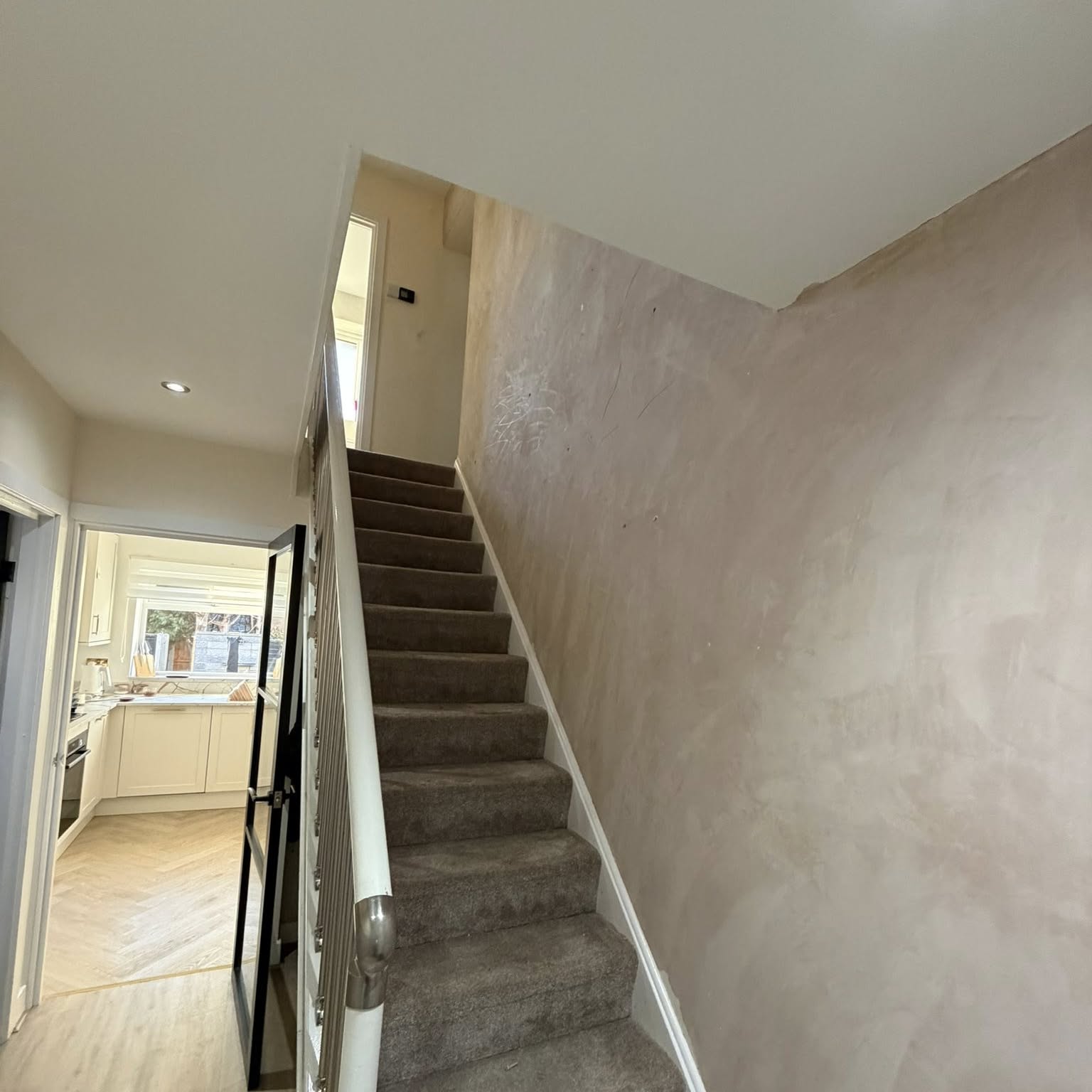 Stairwell and landing freshly decorated in warm neutral tones